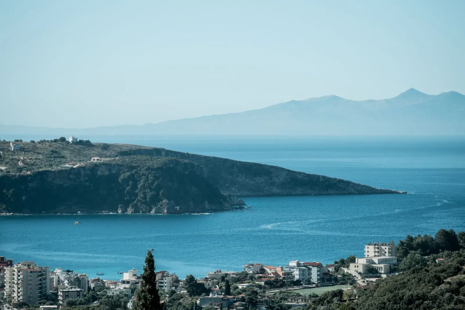 The Vlorë coastline with greenery and a blue sea