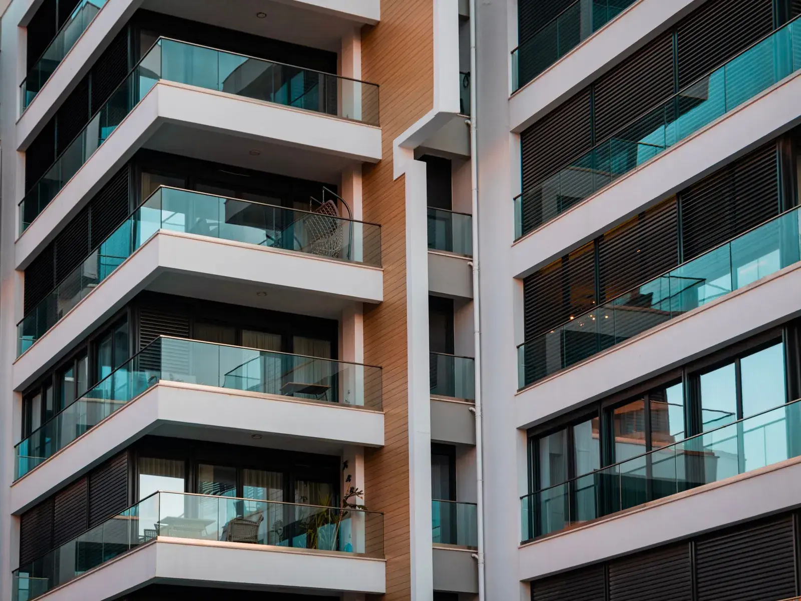 Facade of a modern apartment building with glass balconies