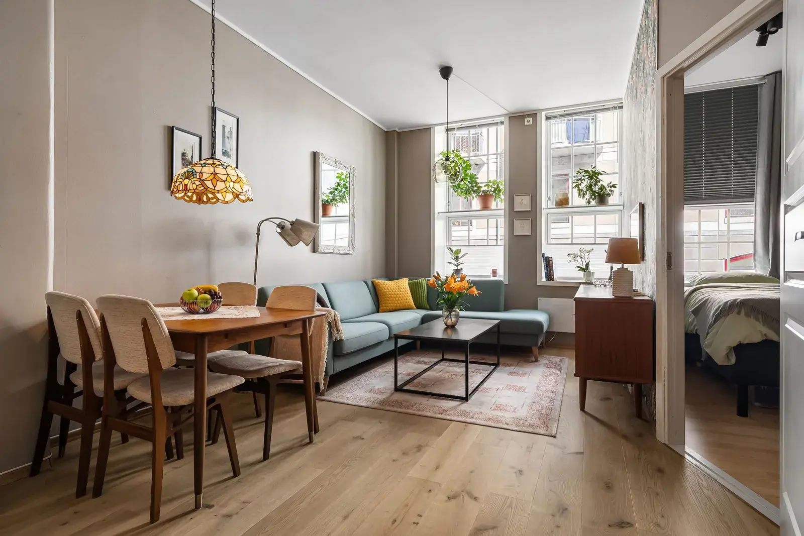 Furnished apartment with a living area and a dining table
