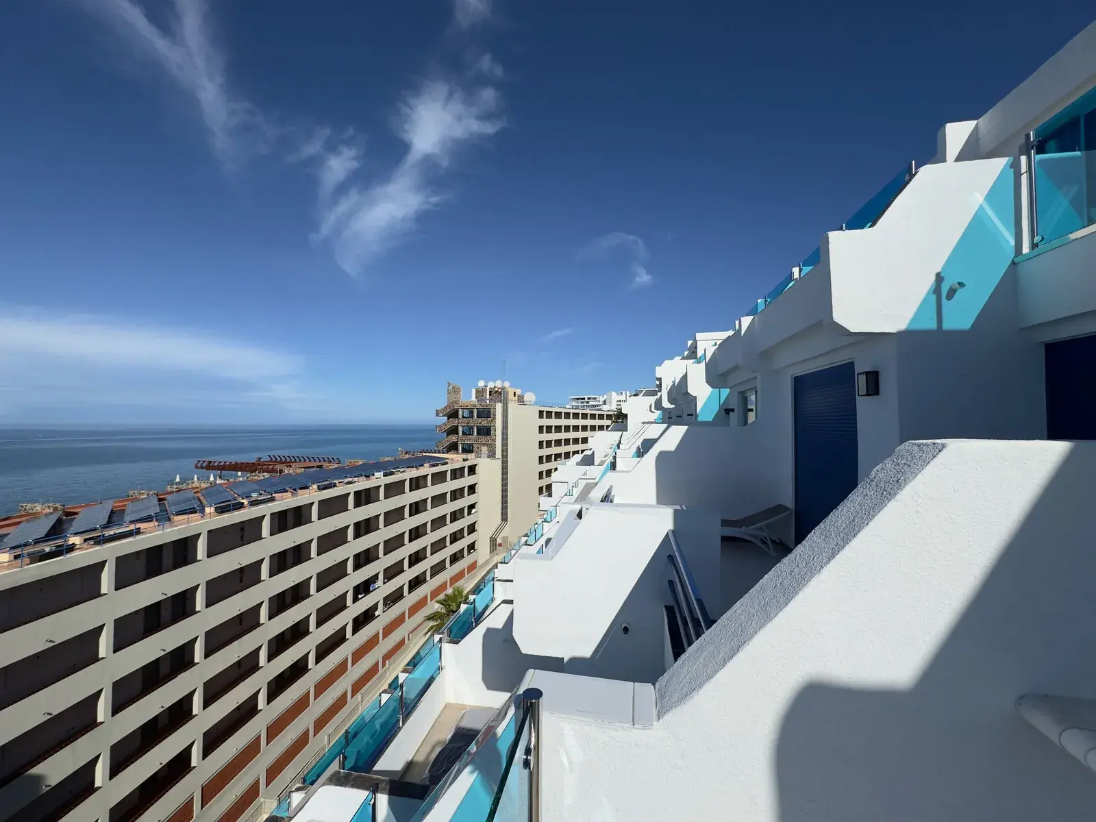 Modern white apartments with a view of the sea