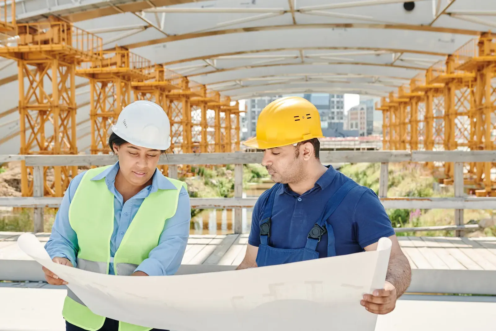 Engineers reviewing the building plans on a construction site