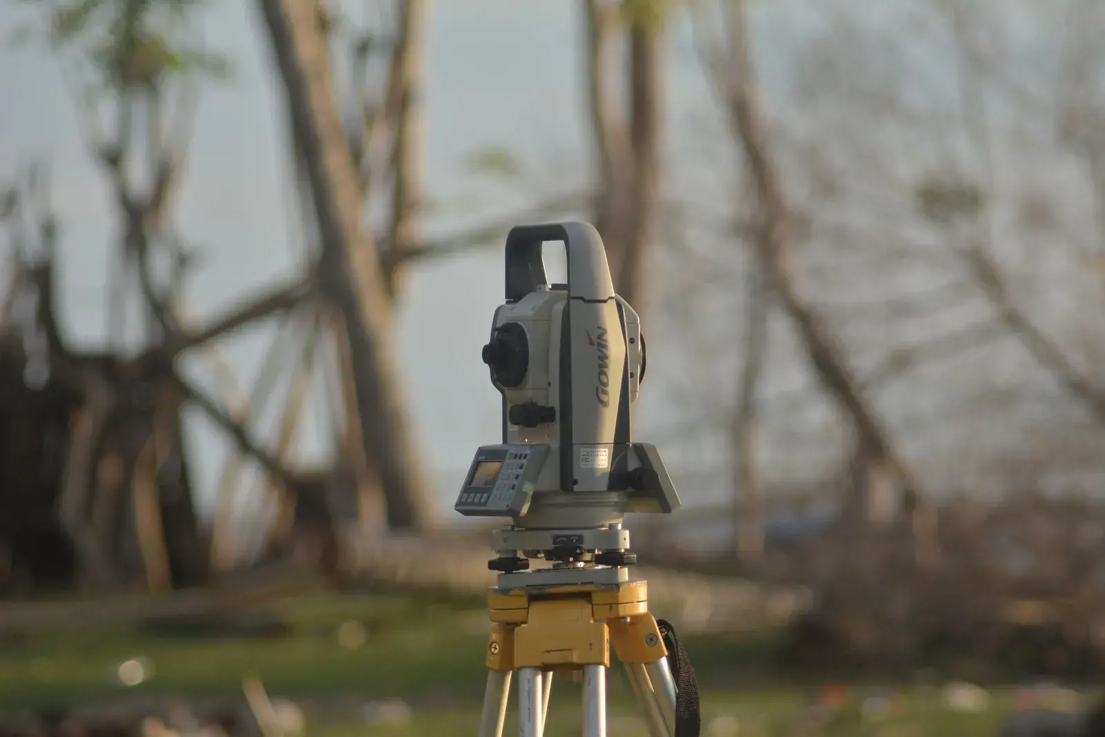 Surveying total station on a tripod used to measure property boundaries