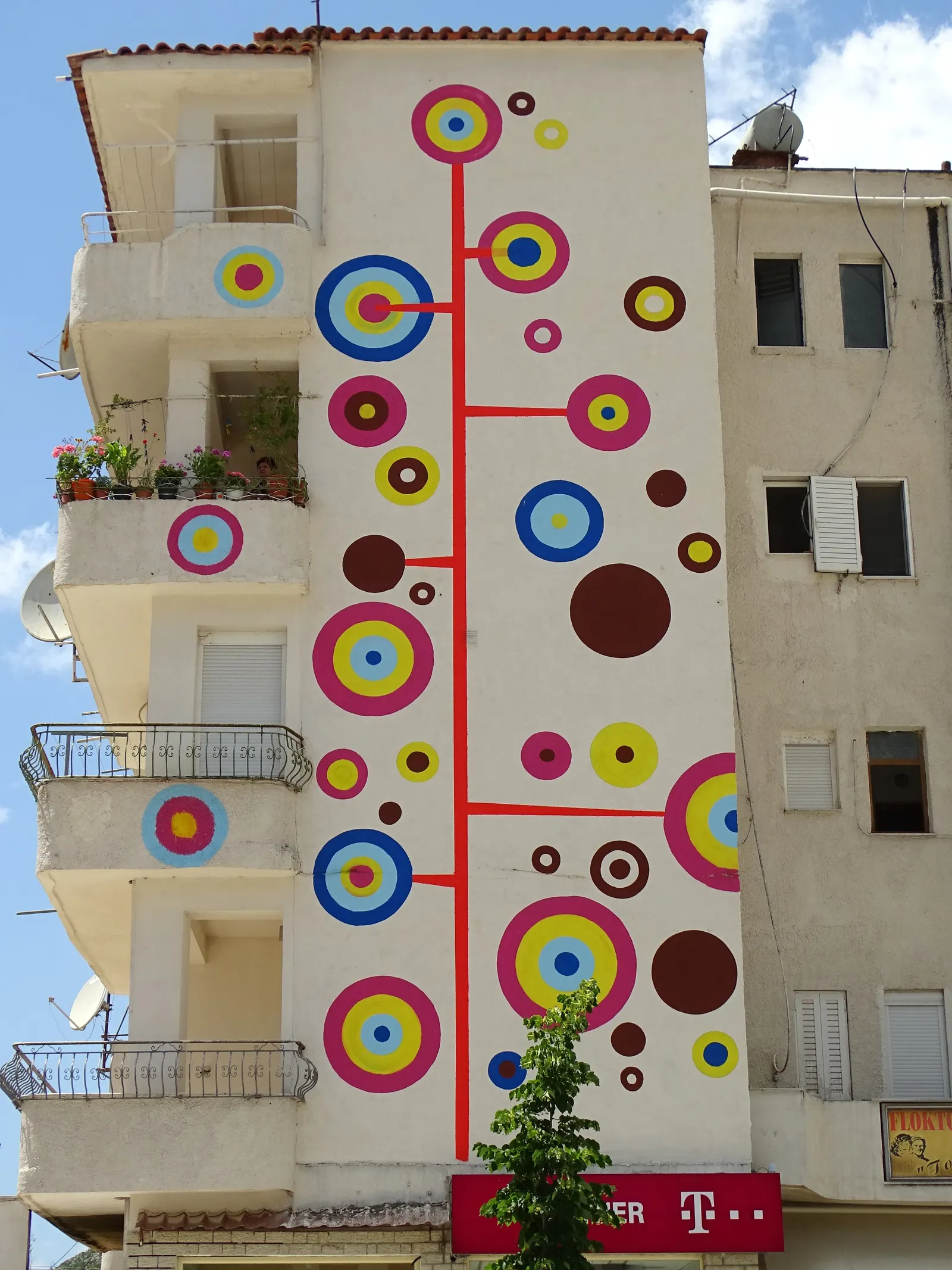 Brightly painted apartment block in Delvinë