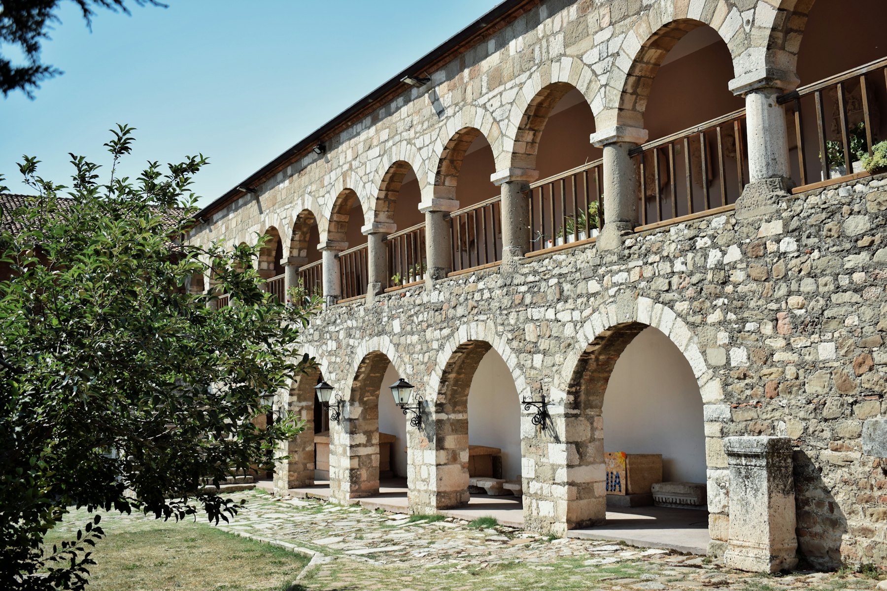 A stone building with arches and arches around it