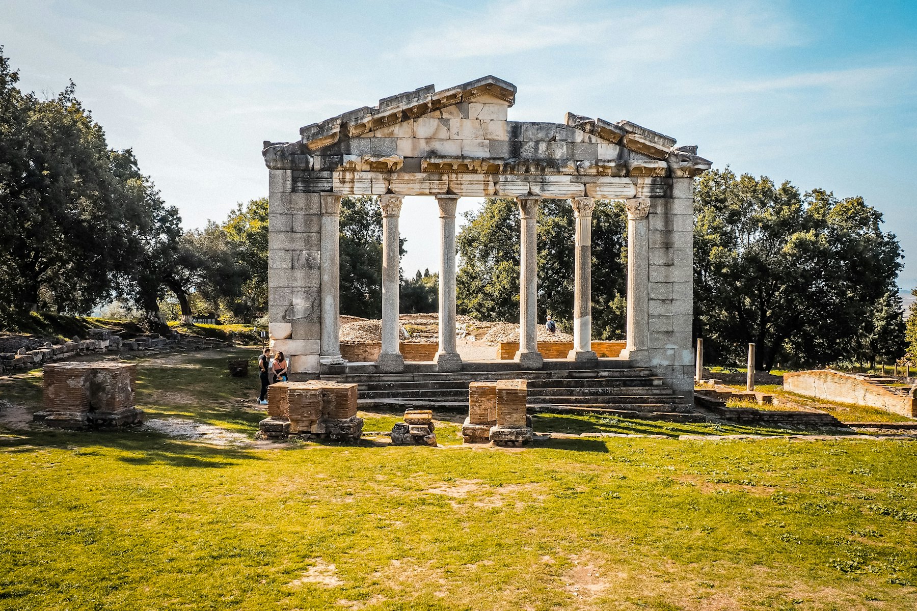 An ancient temple stands under a sunny sky