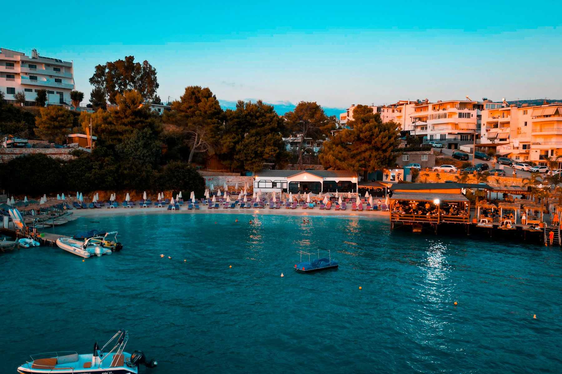 Coastal resort town with buildings and boats on the water